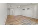 Bright main bedroom featuring hardwood floors, a ceiling fan, and bright windows at 302 W Stella Ln, Phoenix, AZ 85013