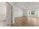 Bright main bedroom featuring hardwood floors, a ceiling fan, and bright windows at 302 W Stella Ln, Phoenix, AZ 85013