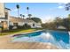 Inviting backyard pool with clear blue water and sunny views of the home's exterior at 302 W Stella Ln, Phoenix, AZ 85013