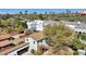 An aerial view of a neighborhood with modern homes and lush landscaping and trees against a bright, blue sky at 32 E 14Th St, Tempe, AZ 85281