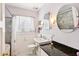 Well-lit bathroom with marble countertop, decorative lighting and shower-tub combination at 32 E 14Th St, Tempe, AZ 85281