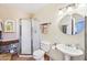 Bright bathroom featuring a glass-enclosed shower and classic fixtures at 32 E 14Th St, Tempe, AZ 85281