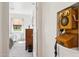 Hallway featuring an antique wooden wall phone and view into a well lit bedroom at 32 E 14Th St, Tempe, AZ 85281