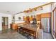 Modern kitchen featuring stainless steel appliances, granite countertops, exposed wood beams, and a large island at 32 E 14Th St, Tempe, AZ 85281