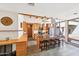 Modern kitchen with stainless steel appliances, granite countertops, an island with seating, and exposed wood beams at 32 E 14Th St, Tempe, AZ 85281