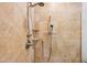 Tiled shower area with adjustable shower head and built in soap and shampoo caddy at 32 E 14Th St, Tempe, AZ 85281