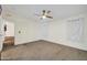 Spacious bedroom with carpet flooring and a ceiling fan at 38203 W Willetta St, Tonopah, AZ 85354