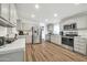 Modern kitchen equipped with stainless steel appliances, ample counter space, and sleek cabinetry at 38203 W Willetta St, Tonopah, AZ 85354