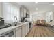 Well-lit kitchen with modern appliances and an adjacent dining area for easy entertaining at 38203 W Willetta St, Tonopah, AZ 85354