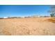 Expansive flat land lot featuring desert landscaping and distant mountain views at 38203 W Willetta St, Tonopah, AZ 85354