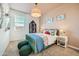 ' bedroom with a green bed frame, a colorful flower comforter, and a window at 38233 N Stillmeadow Rd, San Tan Valley, AZ 85140