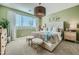 Tranquil main bedroom with a decorative light fixture and neutral tones, creating a relaxing retreat at 38233 N Stillmeadow Rd, San Tan Valley, AZ 85140