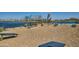 Playground with a lake view, a blue pergola, benches, and outdoor games at 38233 N Stillmeadow Rd, San Tan Valley, AZ 85140