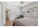 Inviting bedroom with hardwood floors, neutral tones, and a bright window at 40265 N Acadia Ct, Anthem, AZ 85086