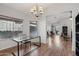 Open dining area with stylish chandelier, laminate floors, and a bright, airy feel at 40265 N Acadia Ct, Anthem, AZ 85086