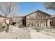 Charming single-story home with a low maintenance desert landscape in front at 40265 N Acadia Ct, Anthem, AZ 85086