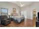 Serene main bedroom with a ceiling fan, en-suite bathroom, and soft natural light at 40265 N Acadia Ct, Anthem, AZ 85086