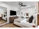 Charming bedroom featuring a ceiling fan, a view of the garden, and a cozy and relaxing atmosphere at 4119 E Indianola Ave, Phoenix, AZ 85018