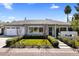 Charming single-story home with a well-manicured front yard and inviting entryway at 4119 E Indianola Ave, Phoenix, AZ 85018