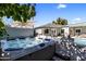 Relaxing hot tub adjacent to pool and outdoor seating area in the backyard at 4119 E Indianola Ave, Phoenix, AZ 85018