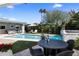 Inviting backyard pool area with comfortable seating and lush landscaping at 4119 E Indianola Ave, Phoenix, AZ 85018