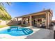 Stunning backyard featuring a pool and covered patio, perfect for outdoor entertaining at 4502 E Meadow Dr, Phoenix, AZ 85032