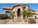 Inviting single-Gathering home boasting an arched entrance and a well-manicured desert landscape at 4502 E Meadow Dr, Phoenix, AZ 85032