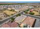 Wide aerial neighborhood view showcasing park with green field, playground, and surrounding well-maintained residences at 4708 S 117Th Ave, Avondale, AZ 85323