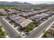 Beautiful aerial view of homes in a suburban neighborhood with lush green fields and mountains in the distance at 4708 S 117Th Ave, Avondale, AZ 85323