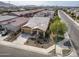 Aerial shot of a tan single-Gathering house with a two-car garage and a landscaped yard in a suburban neighborhood setting at 4708 S 117Th Ave, Avondale, AZ 85323