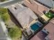 Aerial view of backyard featuring pool, spa, patio, and lush landscaping in a well-maintained neighborhood at 4708 S 117Th Ave, Avondale, AZ 85323