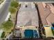 Aerial view of backyard featuring pool, spa, patio, and lush landscaping in a meticulously maintained neighborhood at 4708 S 117Th Ave, Avondale, AZ 85323