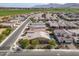 Aerial view of suburban homes featuring well-maintained lawns, tiled roofs, and orderly street layout in a planned community at 4708 S 117Th Ave, Avondale, AZ 85323