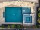 Aerial view of a backyard pool and spa combination, elegantly designed with decorative landscaping, offering a private oasis at 4708 S 117Th Ave, Avondale, AZ 85323