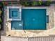 Aerial view of the backyard swimming pool and hot tub, surrounded by lush greenery and a stone-paved deck for relaxation at 4708 S 117Th Ave, Avondale, AZ 85323