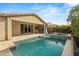 Expansive backyard with pool, spa, covered patio, and seamless access to the home, ideal for outdoor entertaining at 4708 S 117Th Ave, Avondale, AZ 85323