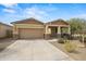 Charming single-story home featuring a covered front porch and low-maintenance desert landscaping at 4708 S 117Th Ave, Avondale, AZ 85323