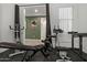 Home gym with exercise bike and weight lifting equipment at 4708 S 117Th Ave, Avondale, AZ 85323