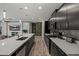 Modern kitchen with stainless steel appliances, shaker cabinets, and a backsplash with white countertops at 4708 S 117Th Ave, Avondale, AZ 85323