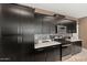 Kitchen with stainless steel appliances, gas range, and modern mosaic backsplash at 4708 S 117Th Ave, Avondale, AZ 85323