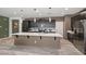 Kitchen featuring dark cabinets, stainless steel appliances, white countertops, and pendant lighting at 4708 S 117Th Ave, Avondale, AZ 85323