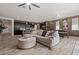 Open concept living room with modern finishes including stylish flooring, comfortable seating and ample space at 4708 S 117Th Ave, Avondale, AZ 85323