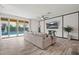 Open concept living room with modern finishes, view of the backyard pool and comfortable seating at 4708 S 117Th Ave, Avondale, AZ 85323