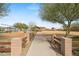 Community playground featuring swings and slides, surrounded by mature trees and open space at 4708 S 117Th Ave, Avondale, AZ 85323