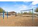 Outdoor playground features swings and picnic pavilion with seating under a bright blue sky at 4708 S 117Th Ave, Avondale, AZ 85323