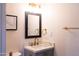 Bathroom featuring vanity, framed mirror, and gold fixtures at 5106 N 17Th Ave # 3, Phoenix, AZ 85015