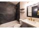 Elegant bathroom featuring sleek marble tile, brushed gold finishes, and modern vanity at 5106 N 17Th Ave # 3, Phoenix, AZ 85015