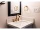 Bathroom with a white marble countertop, elegant gold fixtures, and modern design at 5106 N 17Th Ave # 3, Phoenix, AZ 85015