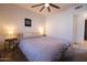 Neutrally decorated bedroom, a ceiling fan and comfortable bed with grey and white bedding at 5106 N 17Th Ave # 3, Phoenix, AZ 85015