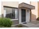 Close up of front door and window featuring neutral colors and tidy landscaping at 5106 N 17Th Ave # 3, Phoenix, AZ 85015